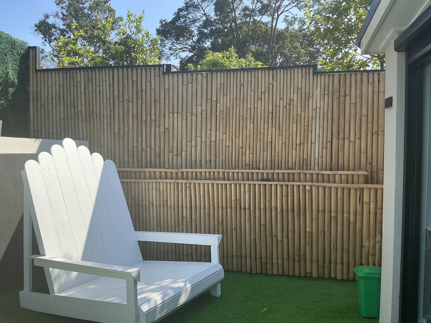 Bamboo screen and a chair built for two