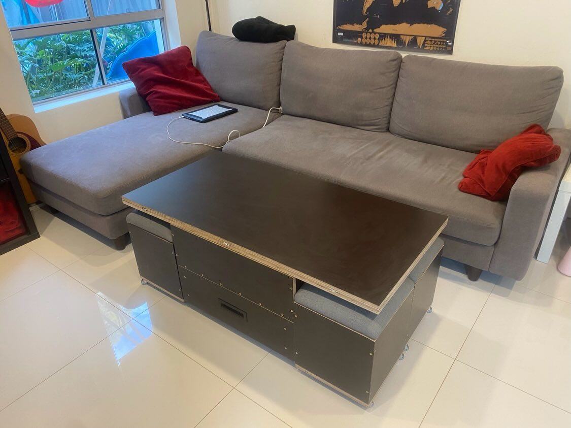 A coffee table that hides its own stools